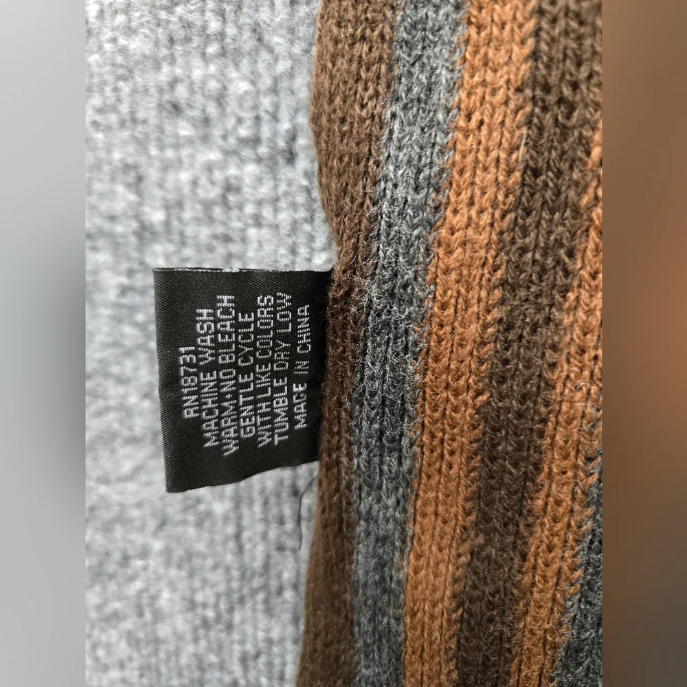 Womens Scarf featuring multicolor stripes and fringe ends. Perfect Pop Of Color‎